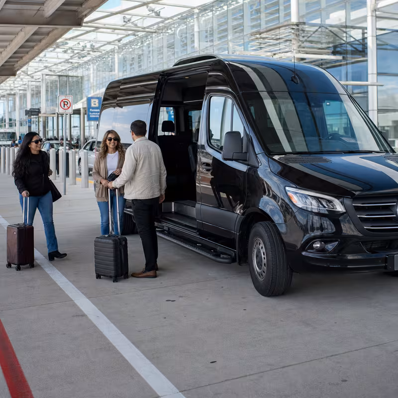 Group boarding a white charter bus for Airport Transportation transportation in Arlington