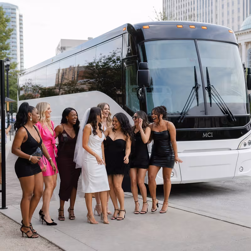 Passengers loading luggage while boarding an Arlington group shuttle