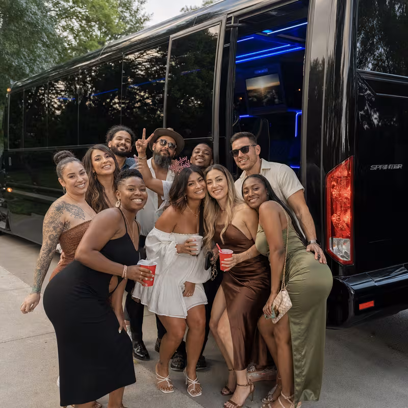 Party bus interior with wraparound leather seating and LED lighting in Arlington