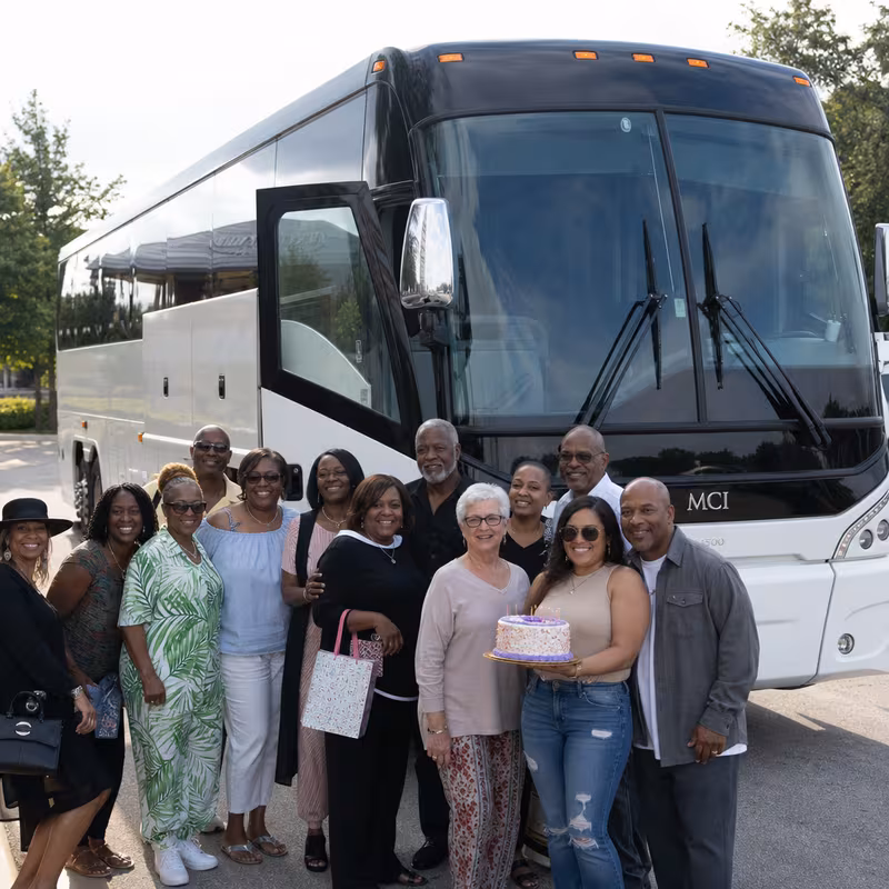 Passengers loading luggage while boarding an Arlington group shuttle