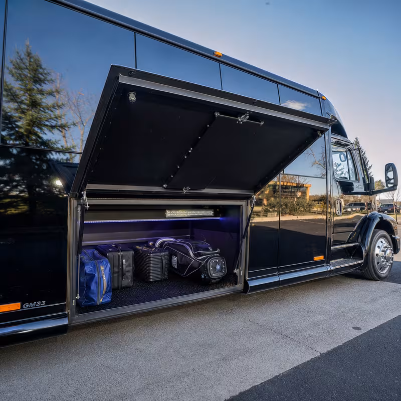 Party bus interior with wraparound leather seating and LED lighting in Arlington