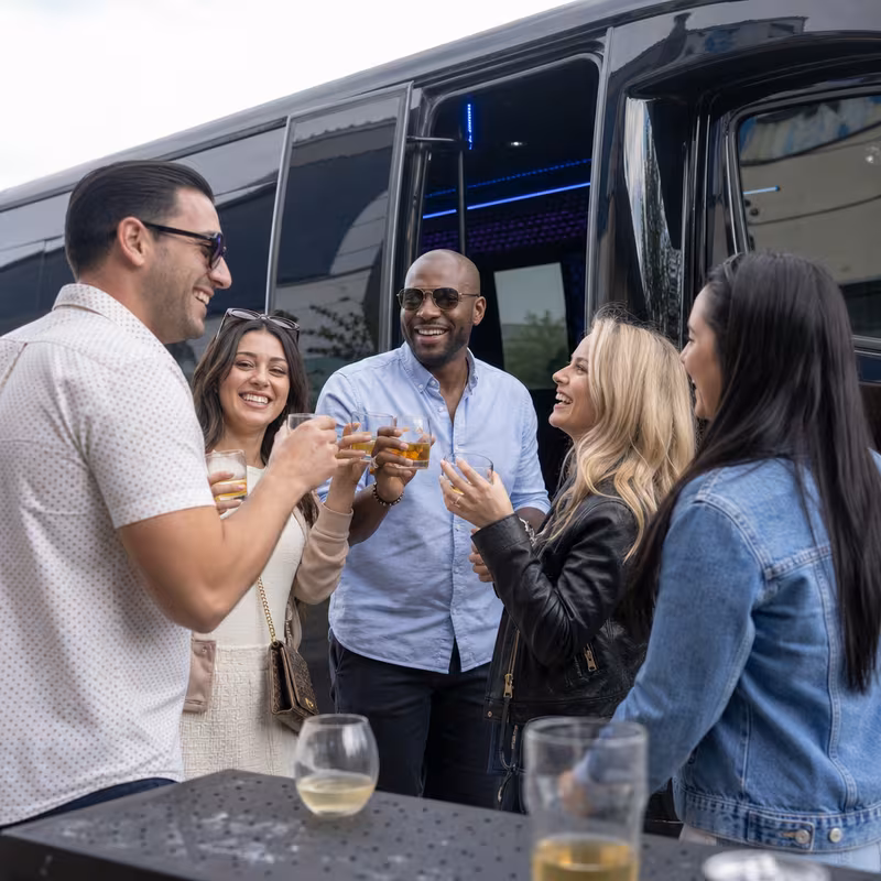Passengers loading luggage while boarding an Arlington group shuttle